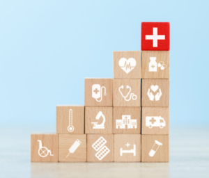 imagem de blocos empilhados com desenhos que remetem à área da saúde