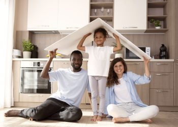 cute family holding roof their head scaled