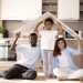 cute family holding roof their head scaled