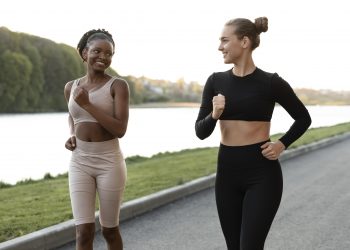 women doing fitness outdoors together scaled