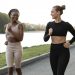 women doing fitness outdoors together scaled