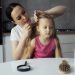 mother taking care child with head lices scaled