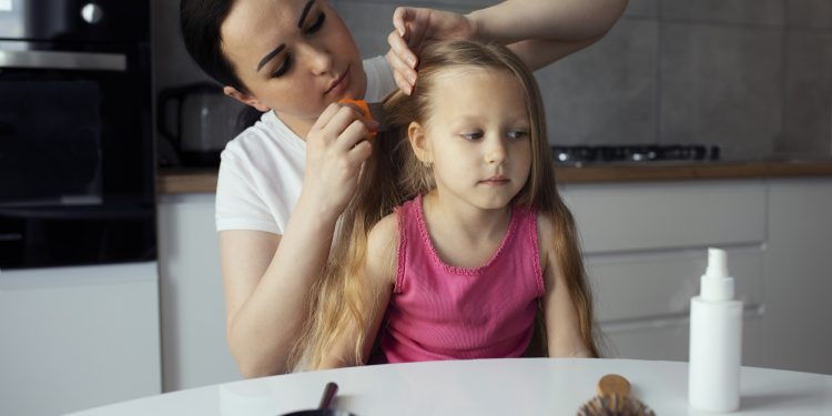 mother-taking-care-child-with-head-lices